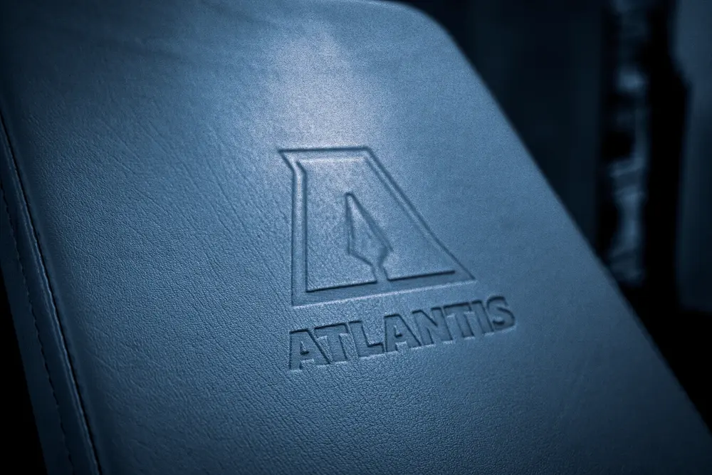 Atlantis logo embossed on an upholstered pad