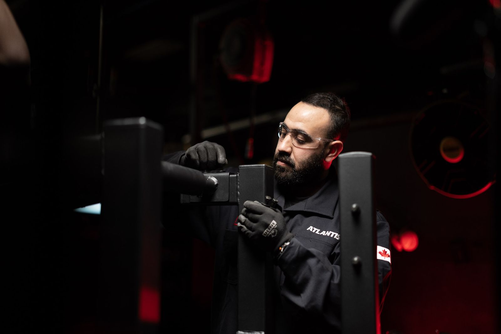An Atlantis builder assembles a machine frame by hand in the Laval factory